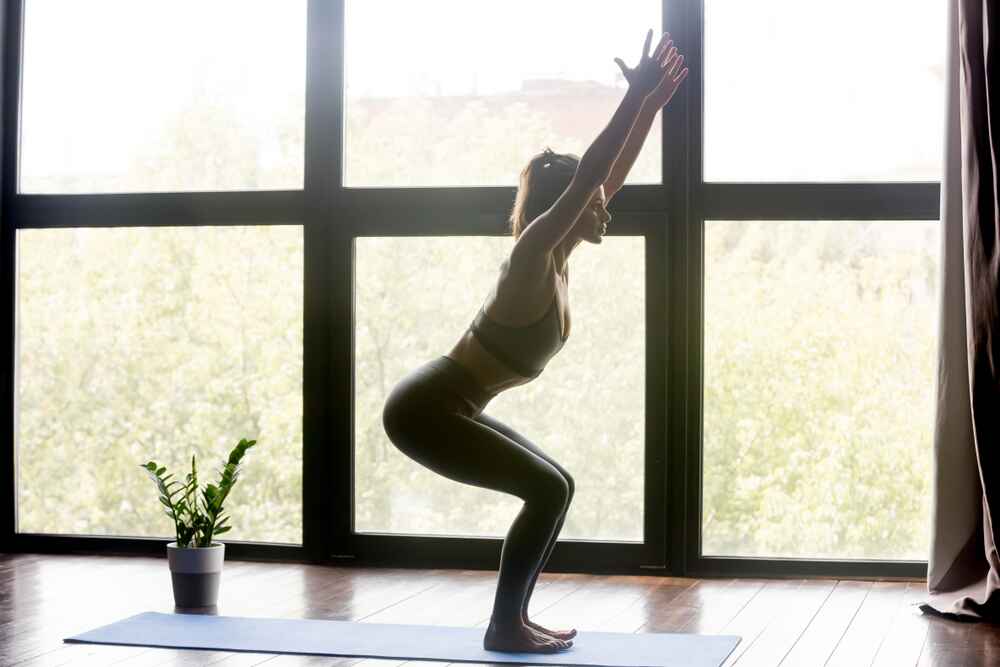 A Woman Practicing Chair Pose
