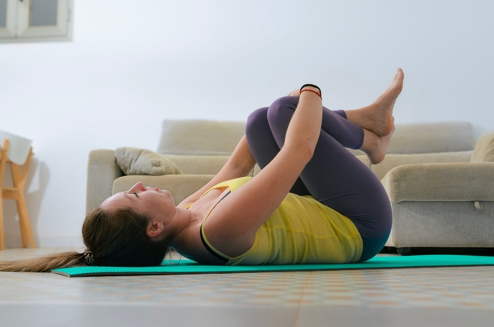 Woman Practicing Pavanmuktasana