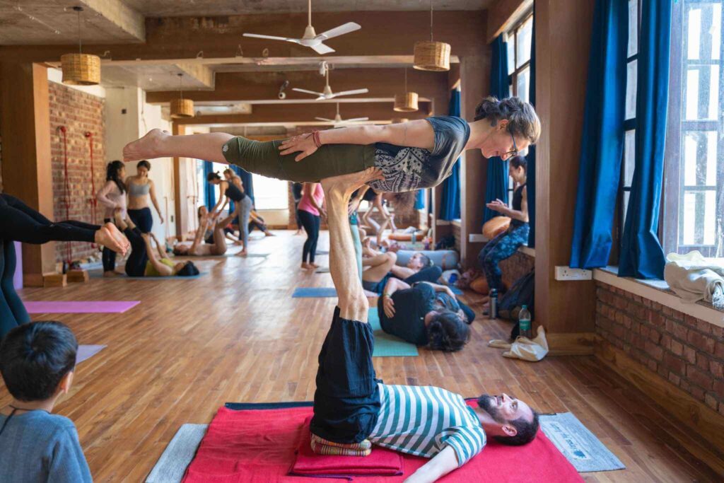 Students practicing advanced yoga