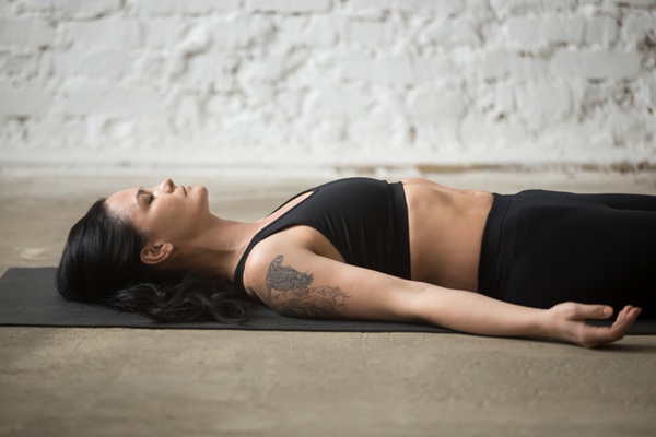 Woman Doing Corpse Pose Woman Doing Corpse Pose