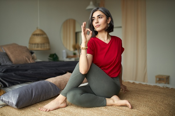 Woman Practicing Ardha Matsyendrasana Which is One of The Best Yoga Moves 