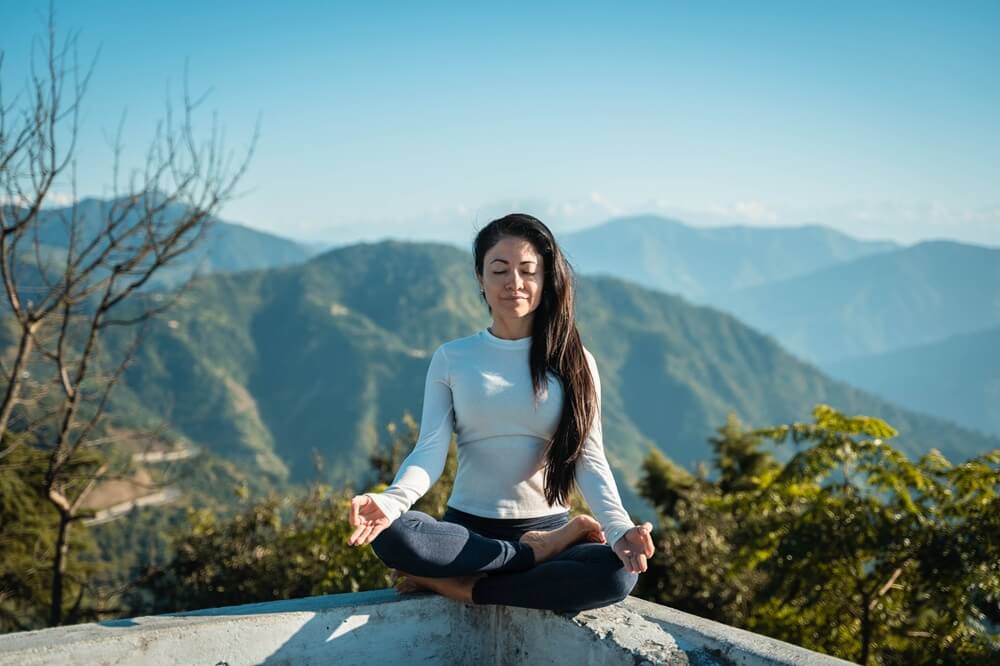 Woman Practising Meditation in Nature