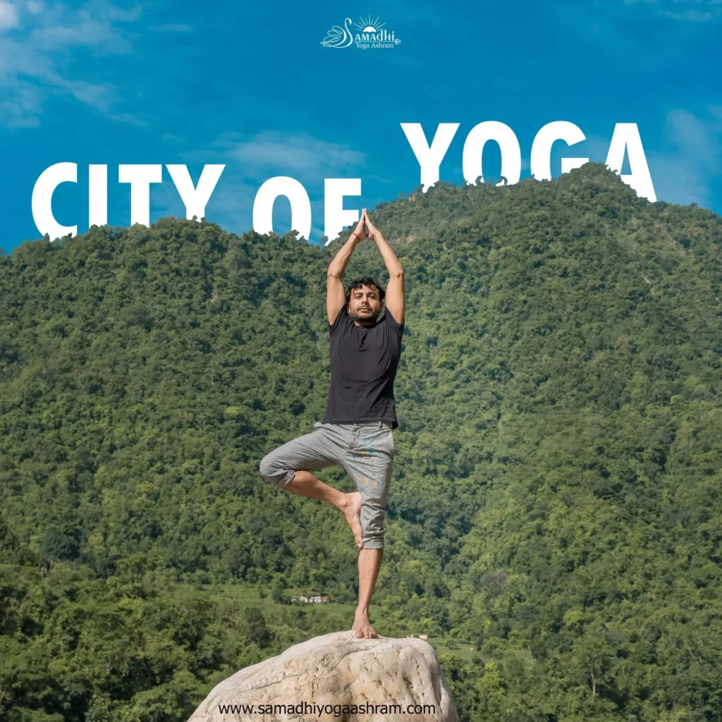 Vrikshasana tree pose yoga practice on a rock in Rishikesh, the yoga capital of India
