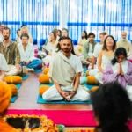 Students practicing yoga during yoga teacher training to experience the yogic lifestyle