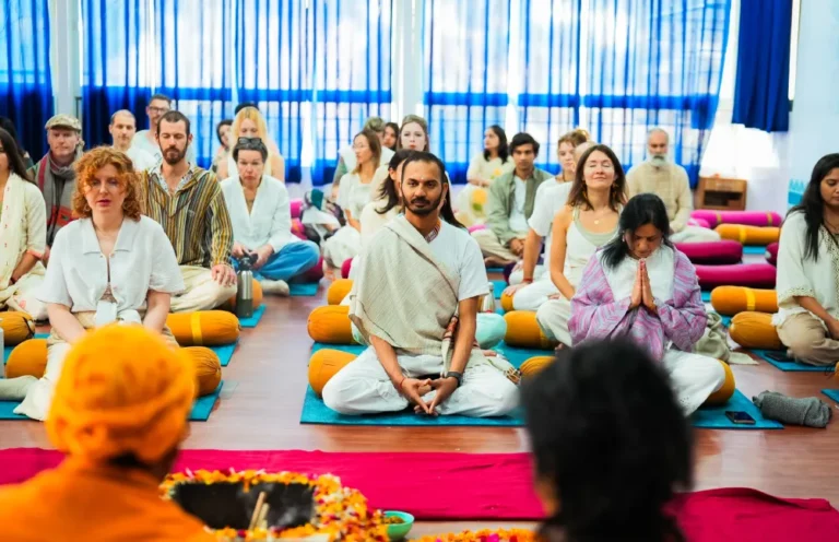 Students practicing yoga during yoga teacher training to experience the yogic lifestyle